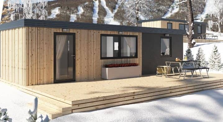 Mobile Home Skia mit Holzfassade und Terrasse
