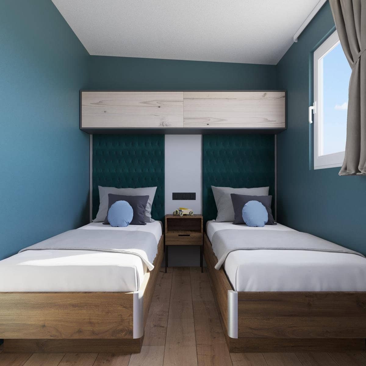 Zweites Schlafzimmer mit zwei Einzelbetten im Skia